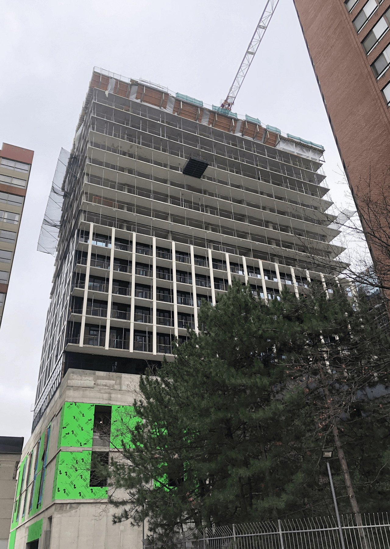 building under construction installing windows