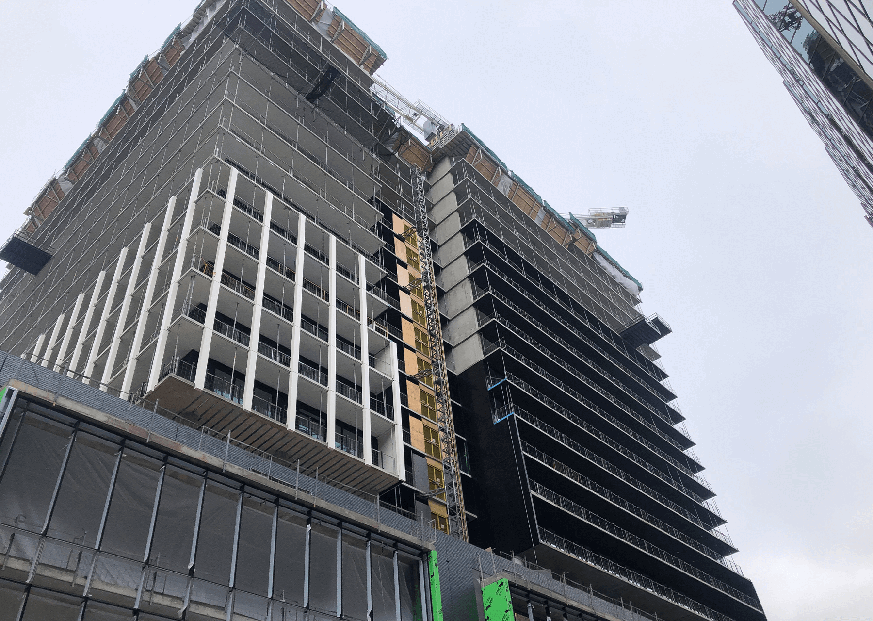 building under construction installing windows